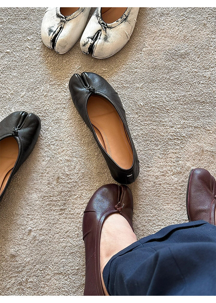 Trendy split-toe leather flats in black, white, and brown on beige carpet, donclickin streetwear style