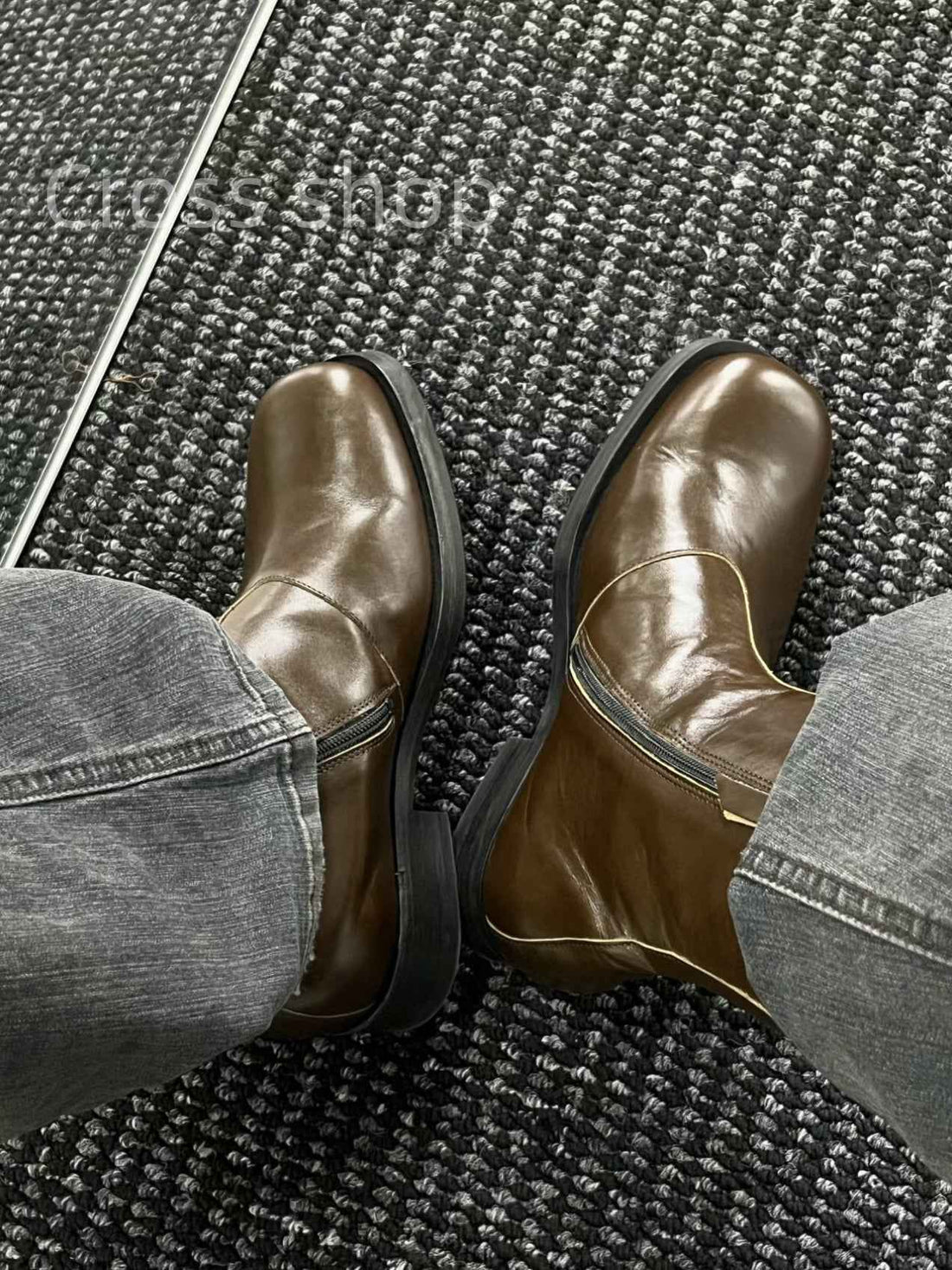 Brown leather motorcycle boots with zippers styled with gray jeans, donclickin streetwear